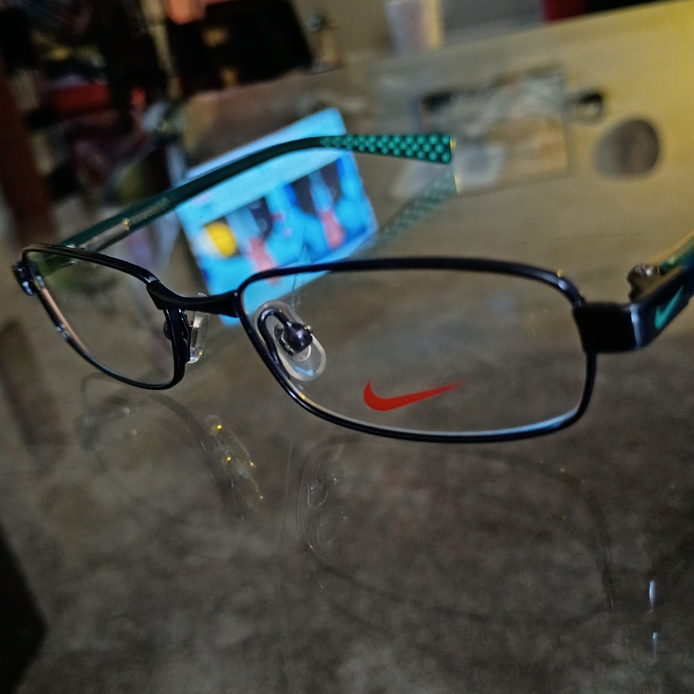 Nike Kids Black Frames with Teal Patterned Temples and Red Logo